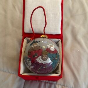 Elegant Nativity Scene Ornament with Red and Gray Accents